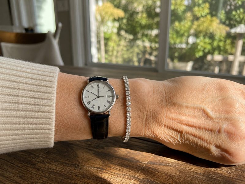 Susan layering the bracelet with her watch